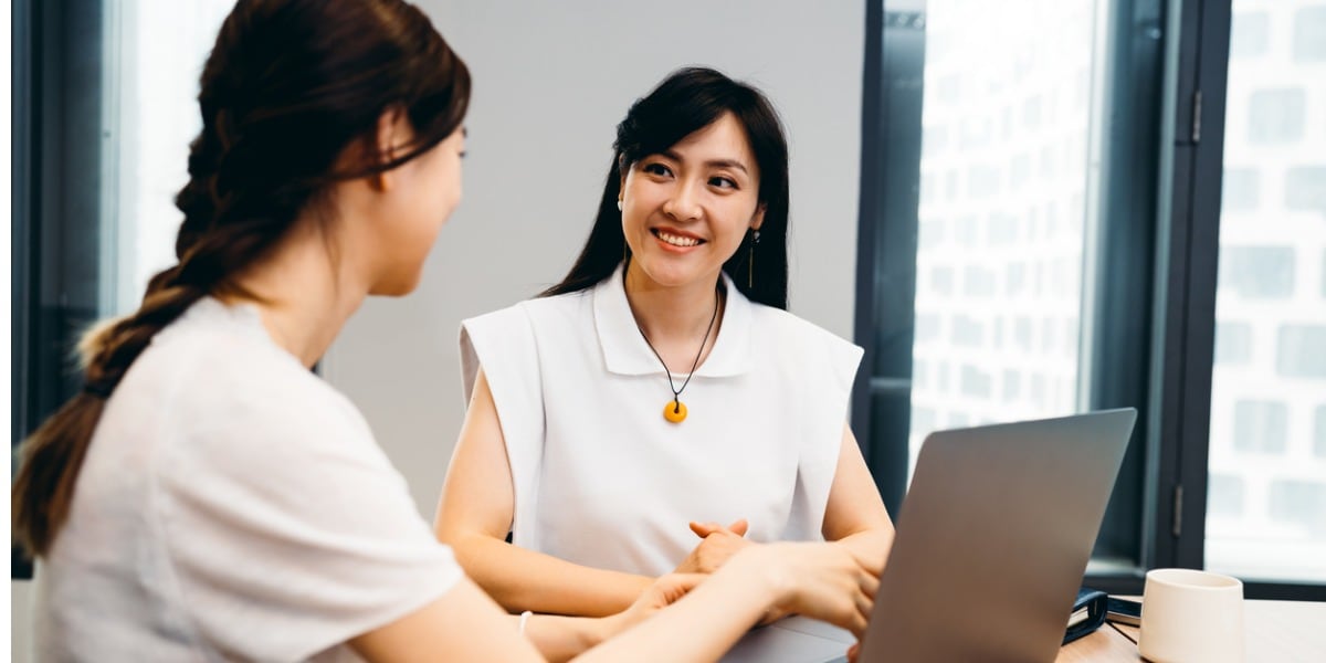 two professional business women working in the office